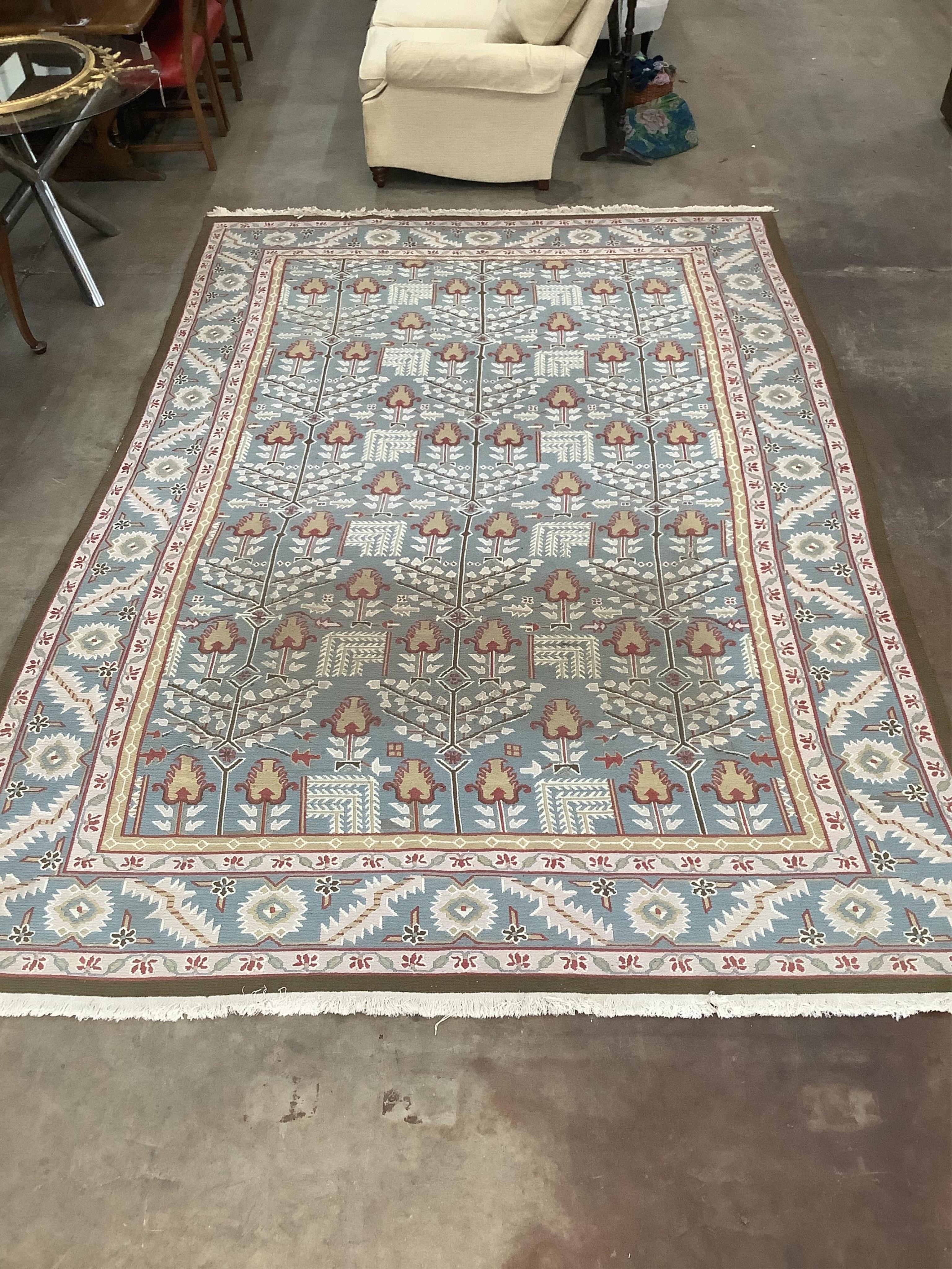 A modern Caucasian style pale blue ground carpet, 370 x 242cm. Condition - fair